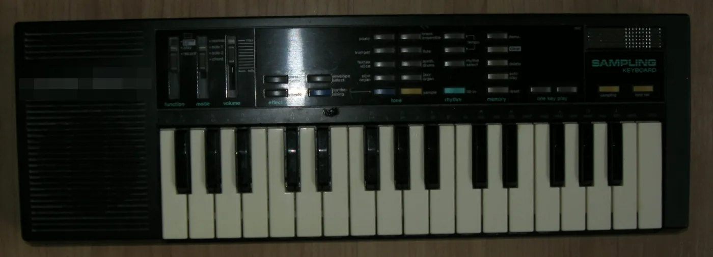 My dad's 1985 sampling keyboard on the floor, photographed from above with the flash on